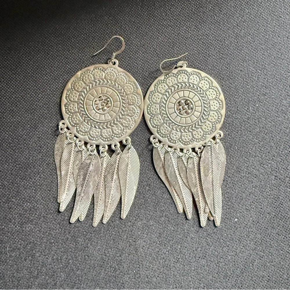 Medallion and Feather Dangle Earrings in Silver Tone